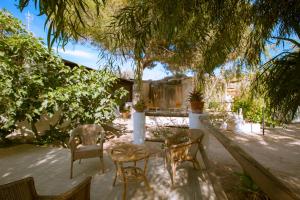 Um jardim em L'Oasi Villaggio Albergo