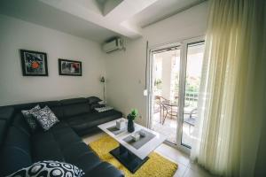 a living room with a couch and a table at Apartments Horizont in Budva