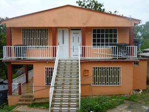 a house with a staircase in front of it at Posada Nativa Miss Casira in San Andrés