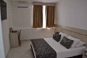 Voodi või voodid majutusasutuse Hotel Kurakatá toas