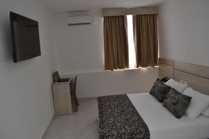 Voodi või voodid majutusasutuse Hotel Kurakatá toas