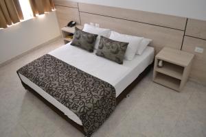 Voodi või voodid majutusasutuse Hotel Kurakatá toas