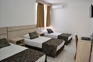 Voodi või voodid majutusasutuse Hotel Kurakatá toas