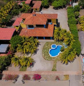 an overhead view of a house with a swimming pool at Solyar Luxury Spanish Beachfront Home in Pochomil