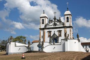 a white building with a cross on top of it at Matosinho's Palace in Matosinhos