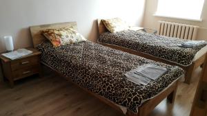 Кровать или кровати в номере Šiauliai Centre Apartment