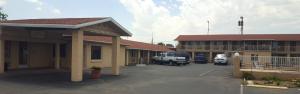 a parking lot in front of a motel at Economy Inn Safford in Safford
