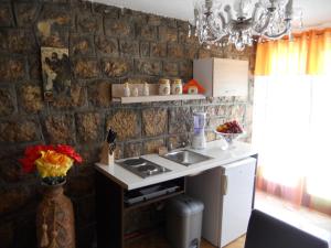 a kitchen with a sink and a counter top at Apartment Djukovic in Petrovac na Moru +63 photos