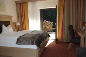 Ein Bett oder Betten in einem Zimmer der Unterkunft Landhotel Windlicht