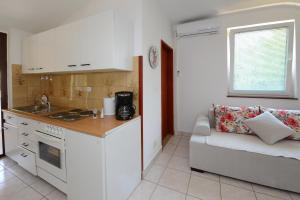 Kuchyň nebo kuchyňský kout v ubytování Apartments Tena