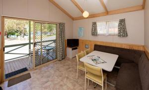 A television and/or entertainment centre at Rainbow Pines Tourist Caravan Park