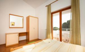 Postel nebo postele na pokoji v ubytování Apartments Hrvatin