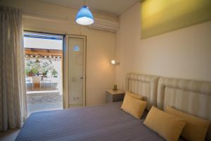 Postel nebo postele na pokoji v ubytování Gea Villas + 37 fotografií