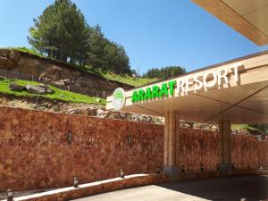 a gas station with a sign for a mountain restart at Ararat Resort Tsaghkadzor in Tsaghkadzor
