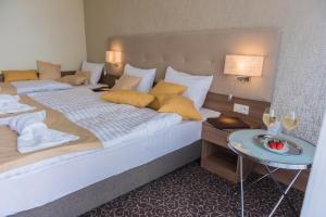 Postel nebo postele na pokoji v ubytování Hotel Thermalpark