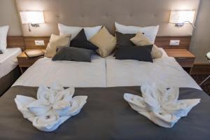 Postel nebo postele na pokoji v ubytování Hotel Thermalpark