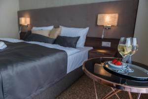 Postel nebo postele na pokoji v ubytování Hotel Thermalpark