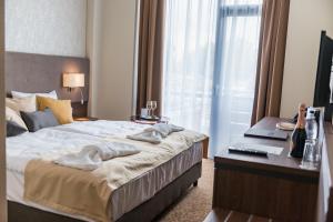 Postel nebo postele na pokoji v ubytování Hotel Thermalpark