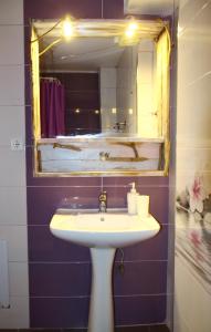 a bathroom with a sink and a mirror at Fasoli Studios in Paralia Panteleimonos +107 photos