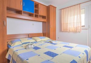 Postel nebo postele na pokoji v ubytování Apartments Cvita Sučić
