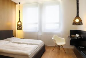 Letto o letti in una camera di Hotel Tomášov