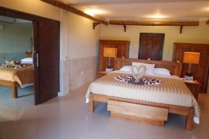 Cama o camas de una habitación en Rinjani Lodge