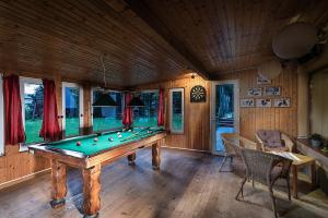 a large room with a pool table in it at Apartmánový dom Spiežovec - Ap. 4 in Donovaly