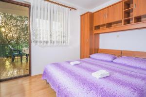 Postel nebo postele na pokoji v ubytování Apartments Cvita Sučić