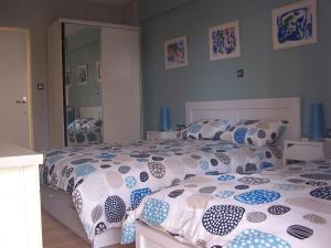 A bed or beds in a room at Athenian apartment with garden, near metro station Chalandri Nu 3