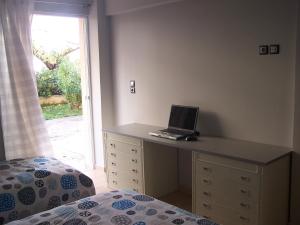 A bed or beds in a room at Athenian apartment with garden, near metro station Chalandri Nu 3