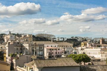 Lounging in the Green Terrace under The Roman Sky