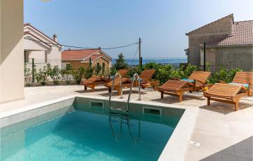 Stunning home in Kucine with Outdoor swimming pool, WiFi and 4 Bedrooms