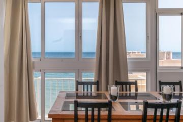 Beachfront 2BR Apartment with Pool & WiFi