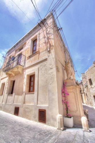 a building with a flower pot in front of it at My Travel House in Rabat