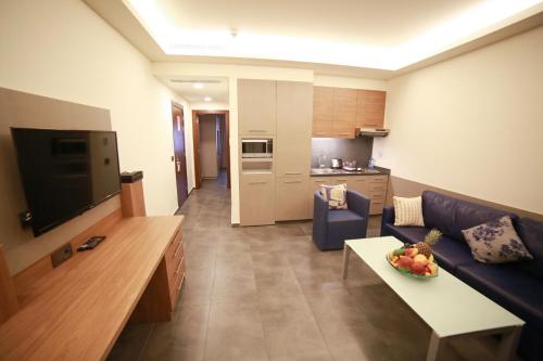 a living room with a couch and a table at Urban Central Suites - Beirut in Beirut