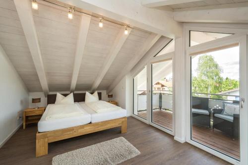 Ένα ή περισσότερα κρεβάτια σε δωμάτιο στο Ferienhaus Villa Alpenpanorama