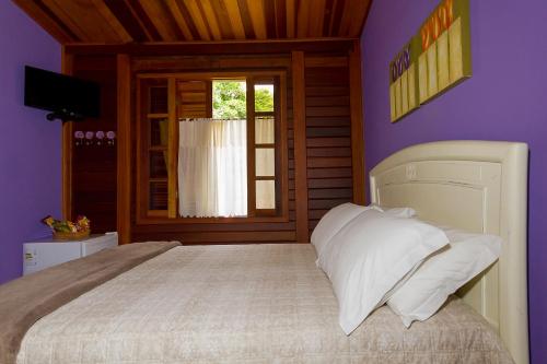 Cama ou camas em um quarto em Pousada Rural Serra Verde