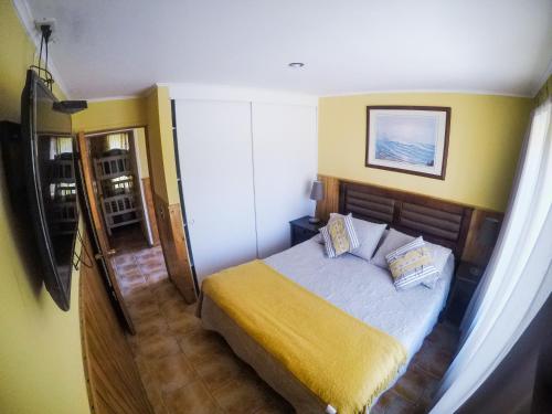 Tempat tidur dalam kamar di Condominio Bahia Inglesa