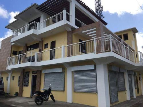 a motorcycle parked in front of a building at Mayon Lodging House in Legazpi