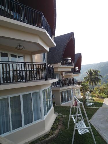 a building with a ladder in front of it at The Duyan House at Sinagtala Resort in Orani