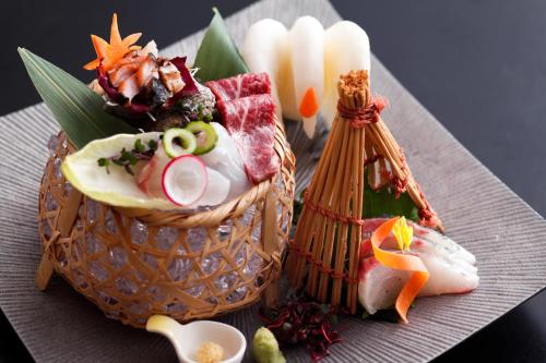 a plate with a basket of food on a table at Kakimotoya in Sango