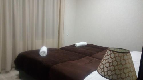 a bedroom with a bed with a computer mouse on it at Roza's guest house in Mestia