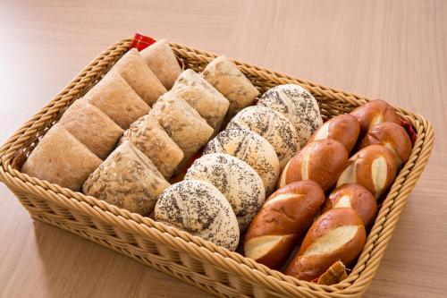 a basket filled with lots of different types of pastries at Hotel Route Inn Hashimoto in Hashimoto
