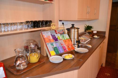 a kitchen counter with some food and drinks on it at Häuslerhof in Maranza