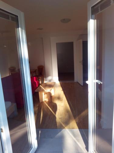 a living room with a sliding glass door at Apartments Pronavtik in Piran
