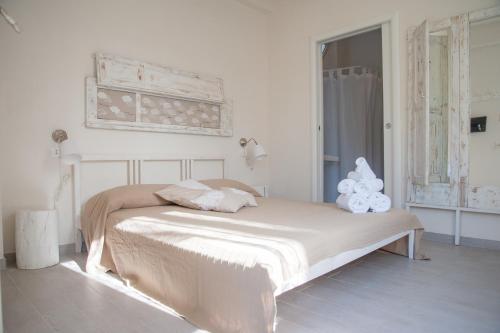 Postel nebo postele na pokoji v ubytování Sottovento Marzamemi Rooms&Relax