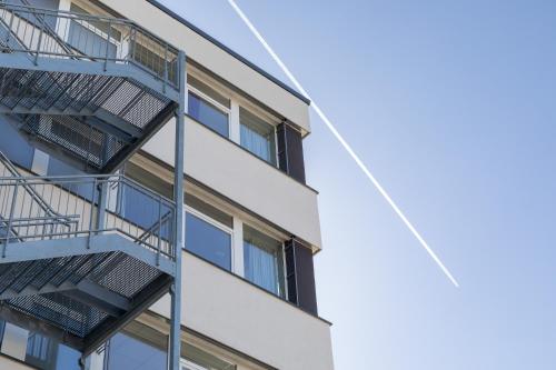 an image of an apartment building with fire escapes at AMH Airport-Messe-Hotel Stuttgart in Filderstadt