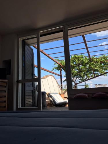 a window in a room with a view of a house at Il Nido del Gabbiano in Vietri sul Mare