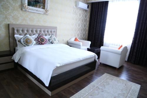 Voodi või voodid majutusasutuse Sunrise Apartments toas