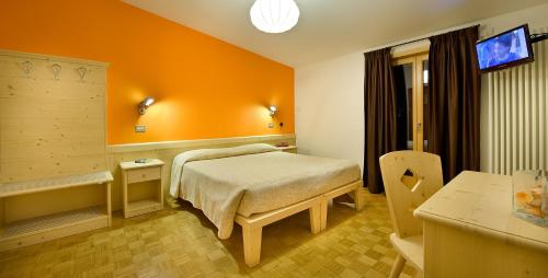 Säng eller sängar i ett rum på Hotel Vallecetta